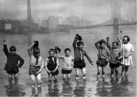 8 children have a fun in the river