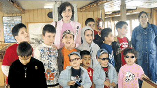 VI children in the Association GLEAM together with H. Bacakoglu and a mother
