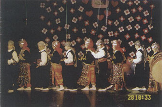 VI boy from the early intervention group folk dancing in primary education integration