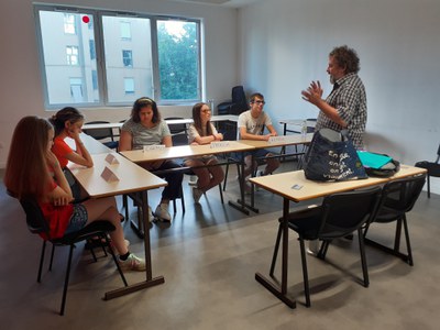 Teacher teaching in one of the 2 rooms